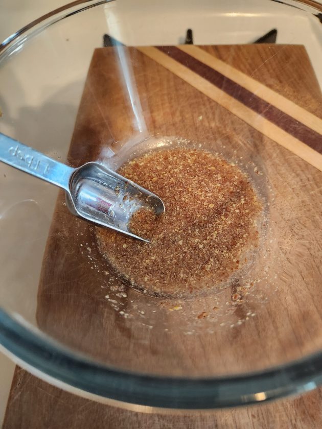glass bowl of flax egg and tbsp measuring spoon