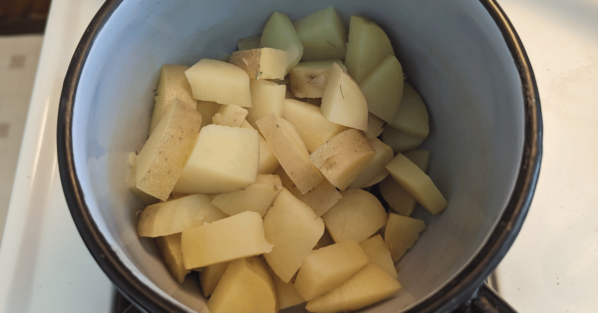 pot of cooked potatoes, diced