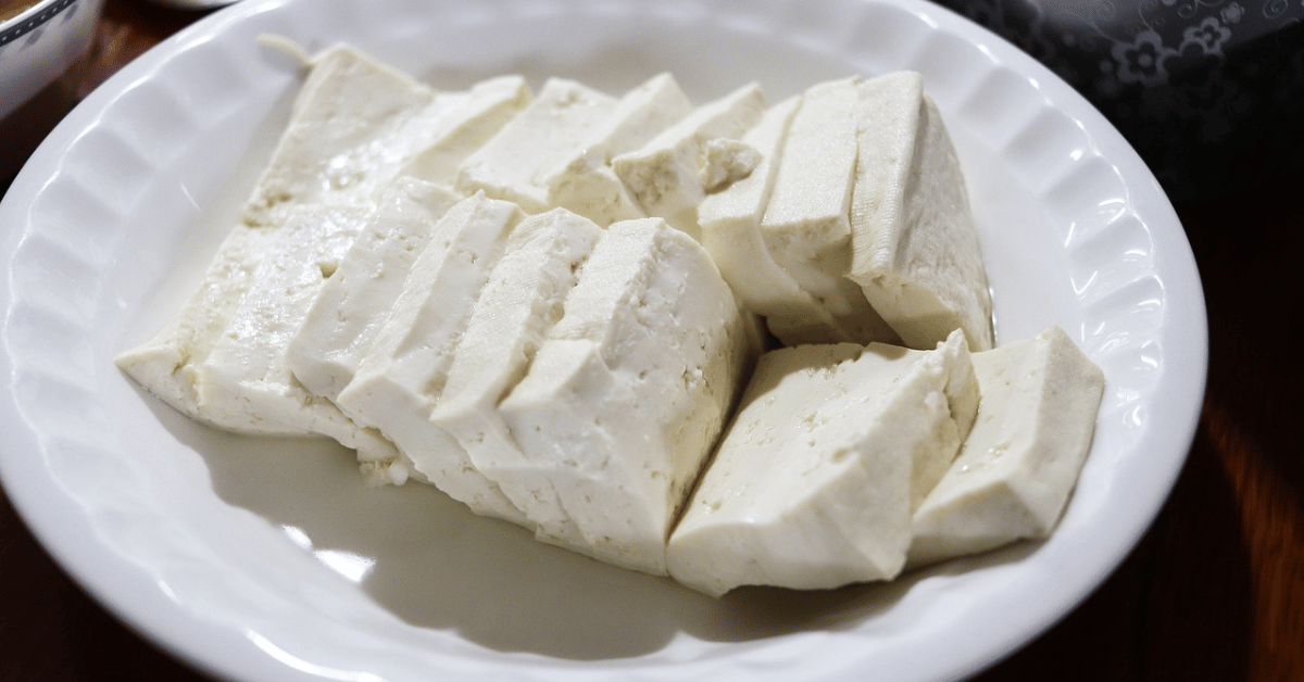 plain tofu slices on a white plate